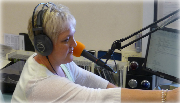 Janet at the sound desk of Brooklands Radio
